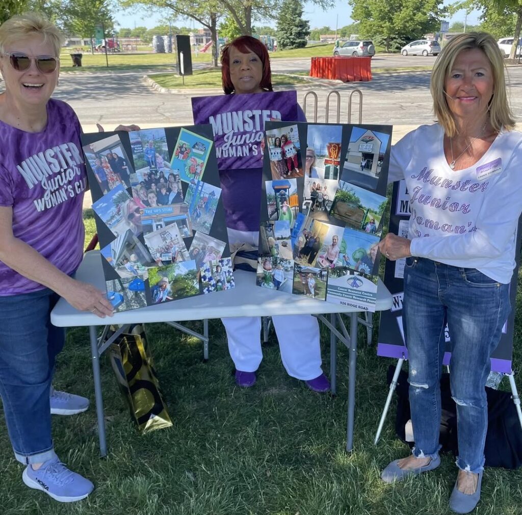 Volunteers promote Discover Munster at a community event.