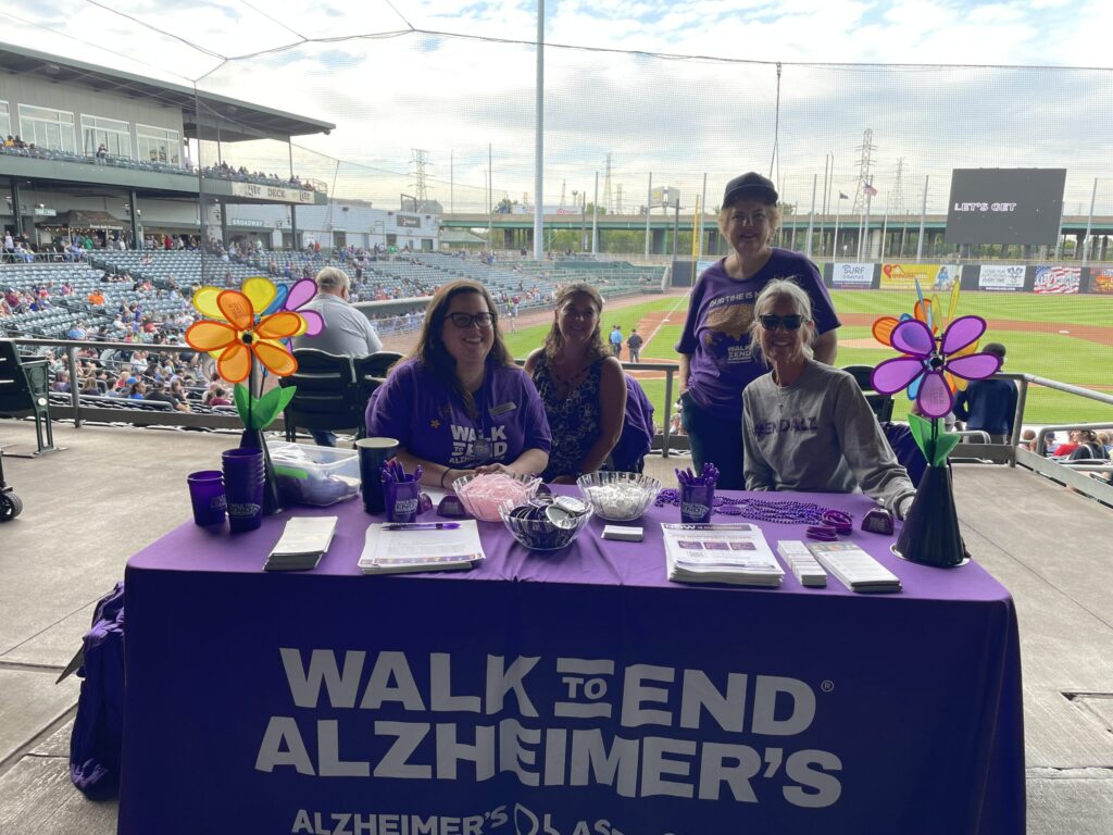 Munster Junior Woman's Club President Rene Sims attends the Northwest Indiana Walk to End Alzheimer's Kickoff Night at the Gary SouthShore RailCats game.