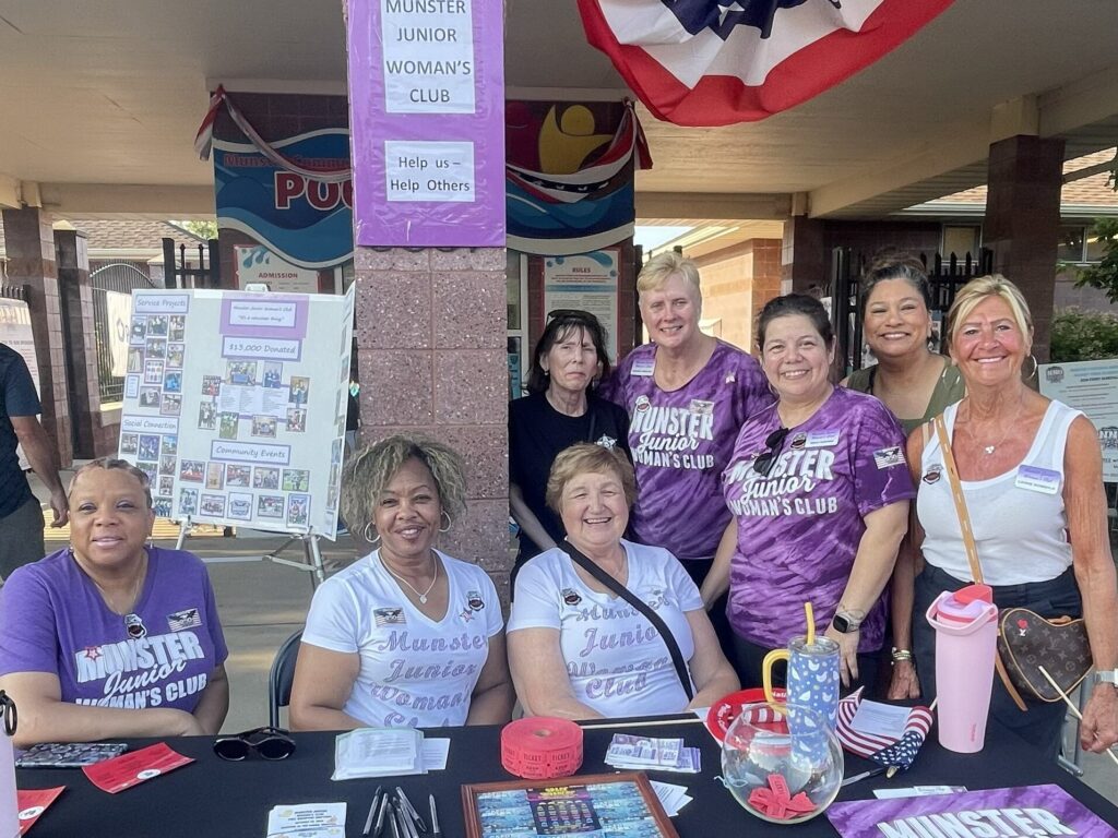 Munster Junior Woman's Club members at their booth during National Night Out Against Crime in Munster, Indiana.